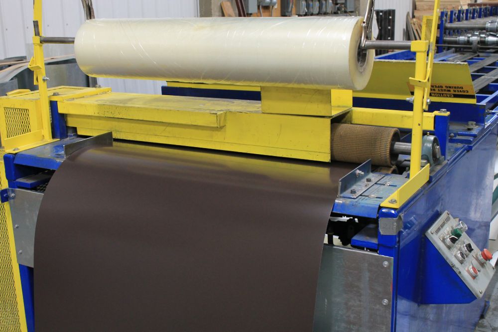 Metal press used to produce sheet metal roof components